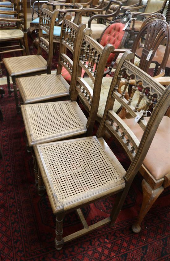 A set of four late 19th century French oak dining chairs